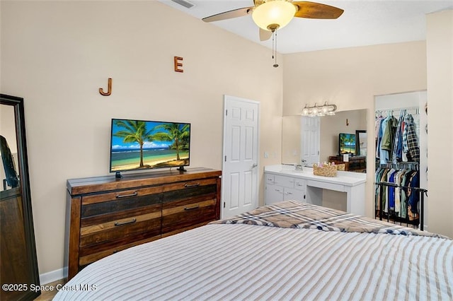 bedroom with baseboards and a ceiling fan