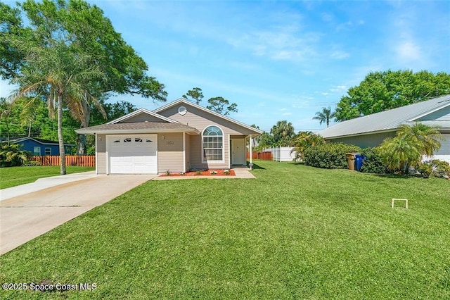 ranch-style house featuring concrete driveway, an attached garage, fence, and a front lawn