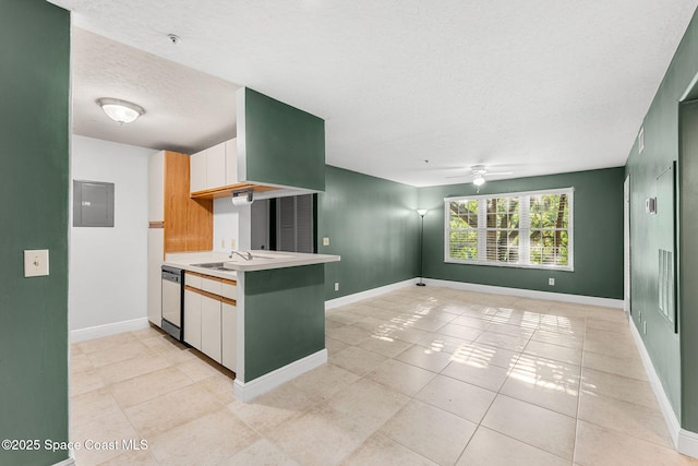 7667 N Wickham Rd Unit 712, Melbourne, FL 32940 - kitchen with dishwasher, a textured ceiling, light countertops, a ceiling fan, and baseboards