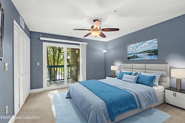 7667 N Wickham Rd Unit 712, Melbourne, FL 32940 - bedroom with access to outside, carpet, ceiling fan, and baseboards