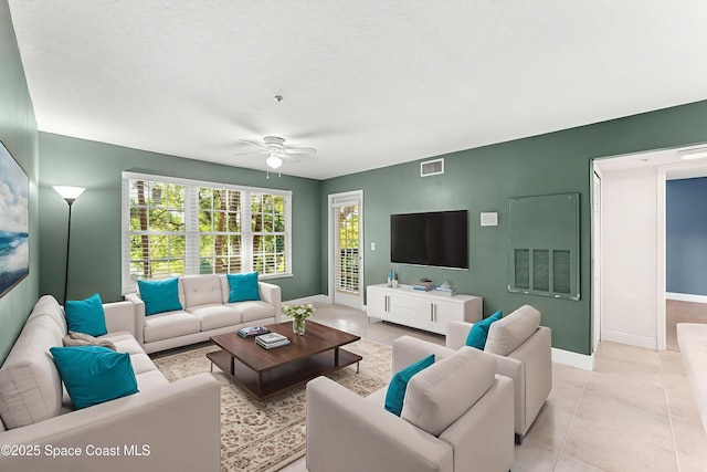 7667 N Wickham Rd Unit 712, Melbourne, FL 32940 - living area featuring ceiling fan, baseboards, and light tile patterned floors