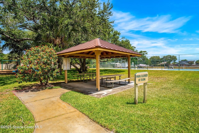 view of home's community featuring a gazebo and a tennis court