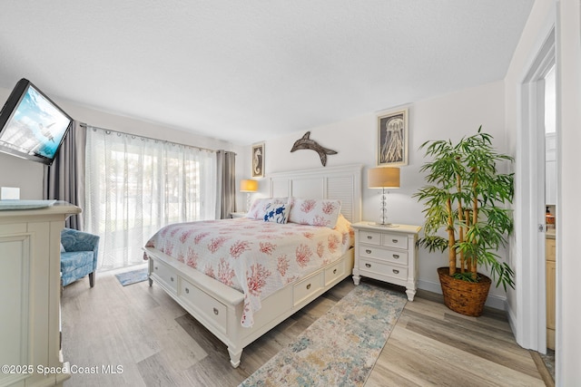 bedroom featuring wood finished floors