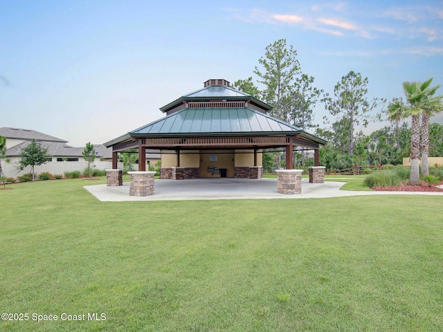 back of house featuring a gazebo, a lawn, a patio, and fence