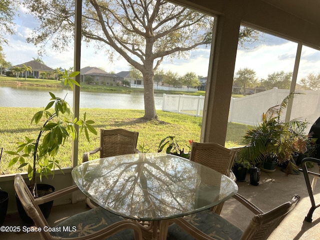 sunroom with a water view