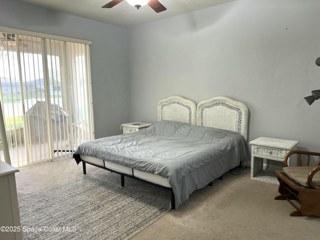 bedroom featuring access to exterior, carpet flooring, and a ceiling fan