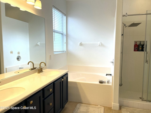 full bath featuring plenty of natural light, a stall shower, and a sink