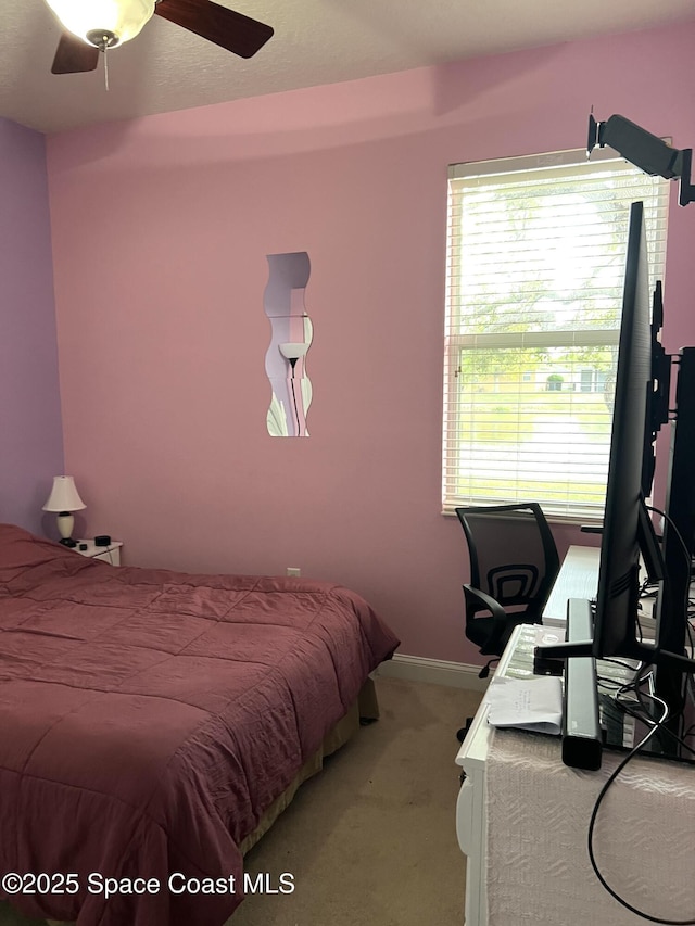 bedroom featuring carpet flooring, a ceiling fan, and baseboards