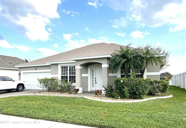 single story home with a front yard, driveway, a shingled roof, stucco siding, and a garage