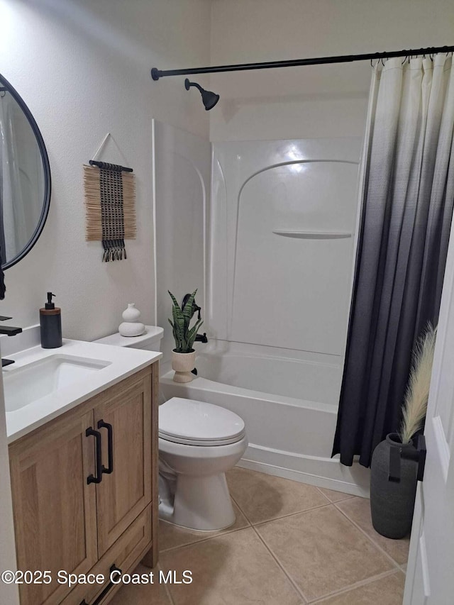 full bath featuring tile patterned floors, toilet, shower / bath combo, and vanity