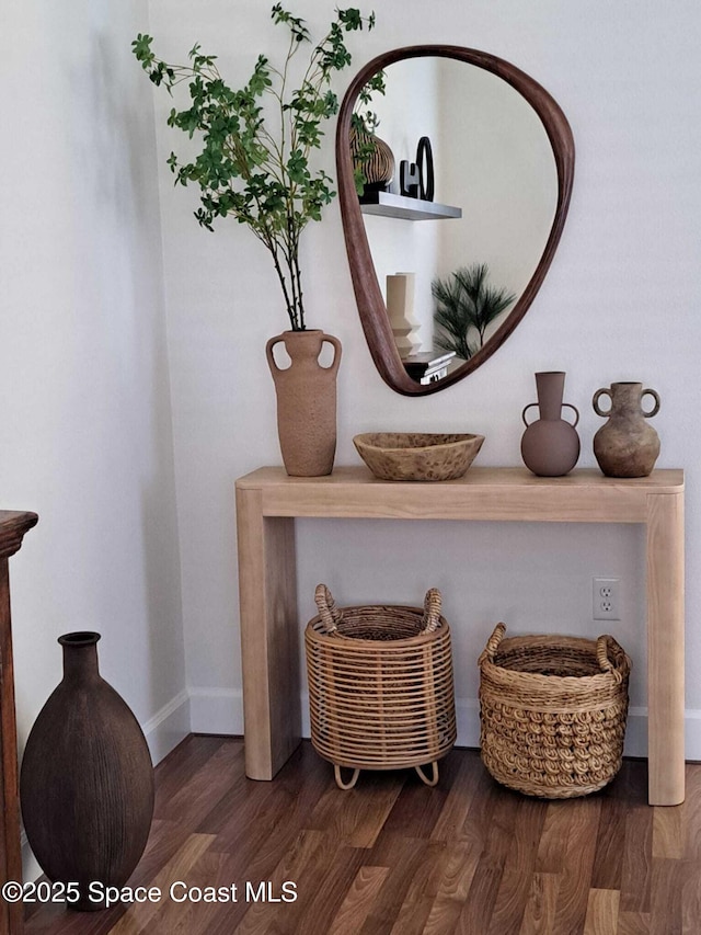 interior details with wood finished floors and baseboards