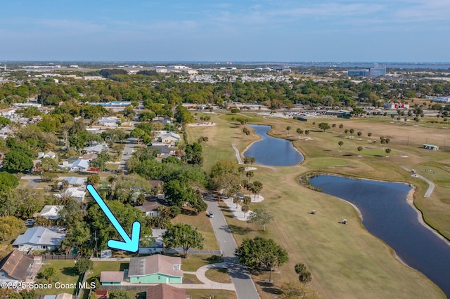 2314 Scenic Dr, Melbourne, FL 32901 - view of property location featuring a nearby body of water, a local golf course, nearby suburban area, and a tree filled landscape