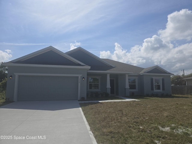 single story home with a garage, concrete driveway, a front lawn, and fence