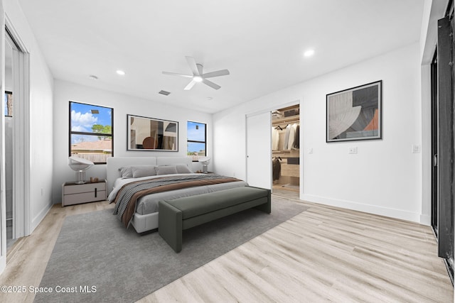 bedroom with visible vents, baseboards, recessed lighting, light wood-style flooring, and a ceiling fan