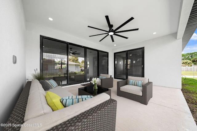 view of patio / terrace with an outdoor living space and a ceiling fan