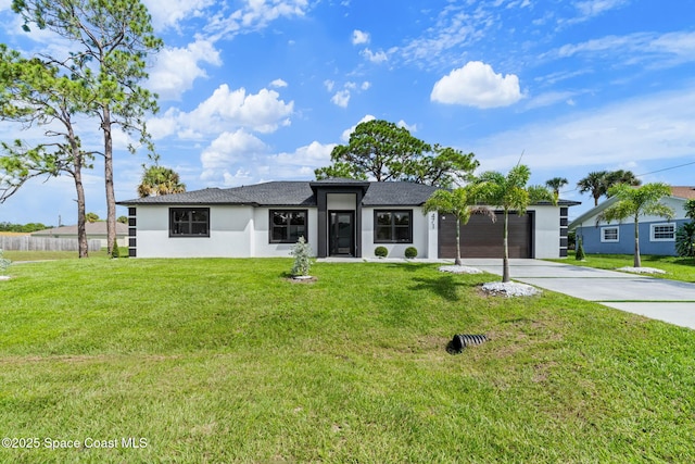 view of front of property with stucco siding, driveway, a front yard, and an attached garage