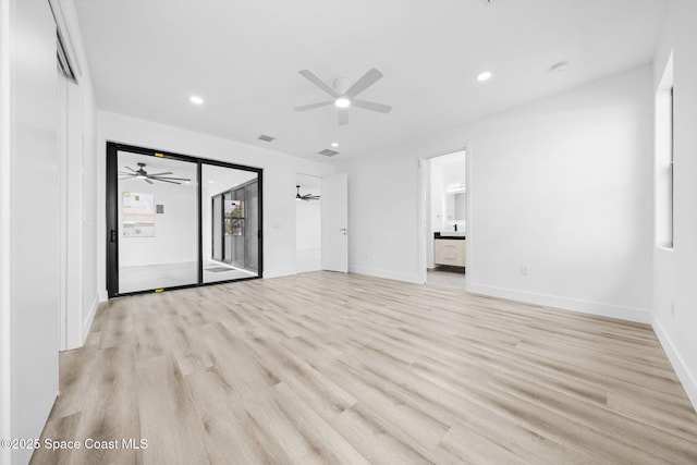 interior space featuring baseboards, light wood-style flooring, and a ceiling fan