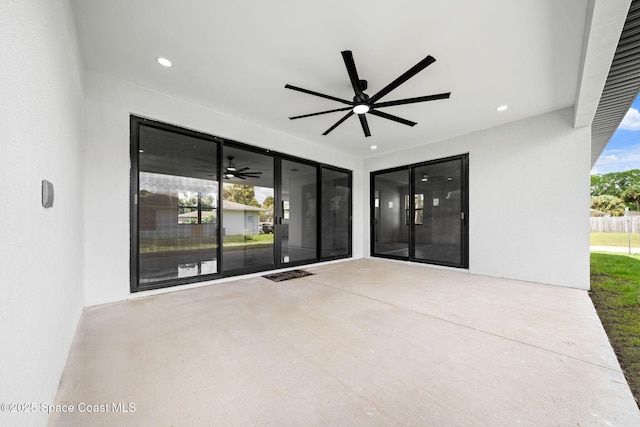 view of patio / terrace featuring a ceiling fan and fence