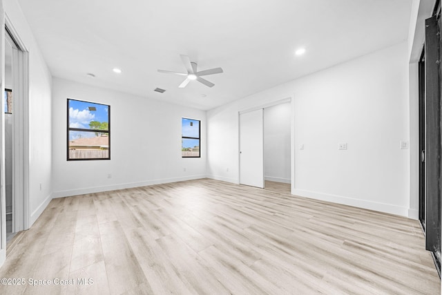 unfurnished bedroom with visible vents, recessed lighting, baseboards, and light wood-style floors