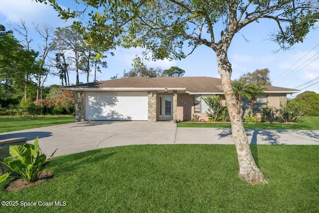 ranch-style house featuring a front lawn, an attached garage, driveway, and stucco siding