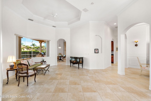 3338 Cappio Dr, Melbourne, FL 32940 - interior space with light tile patterned floors, arched walkways, ornamental molding, visible vents, and a high ceiling