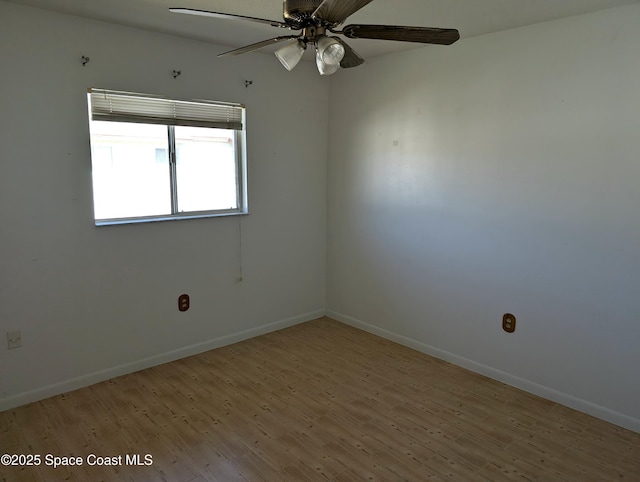 unfurnished room with baseboards, light wood-style floors, and a ceiling fan