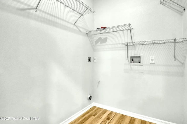 4026 Four Lakes Dr, Melbourne, FL 32940 - washroom featuring washer hookup, wood finished floors, hookup for an electric dryer, laundry area, and baseboards