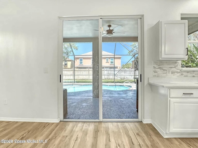 4026 Four Lakes Dr, Melbourne, FL 32940 - doorway with light wood finished floors, baseboards, and ceiling fan