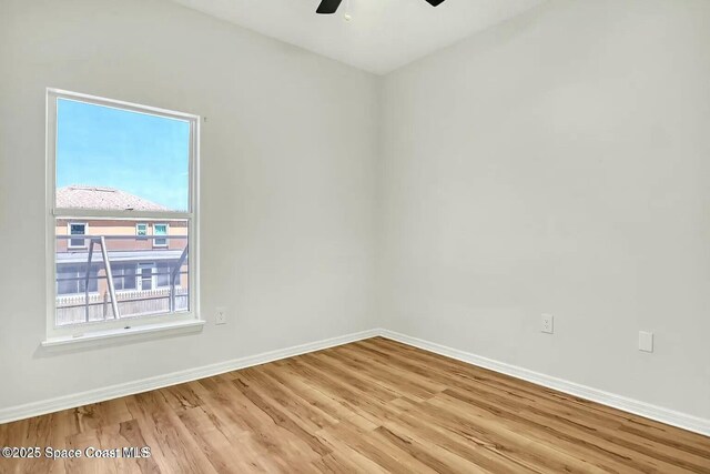 4026 Four Lakes Dr, Melbourne, FL 32940 - spare room featuring baseboards, light wood-style floors, and a ceiling fan