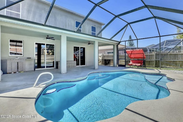 4026 Four Lakes Dr, Melbourne, FL 32940 - view of swimming pool with a fenced in pool, a lanai, a patio, and a ceiling fan