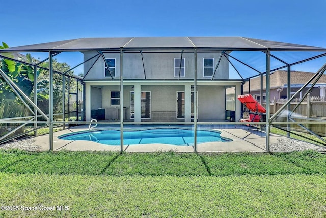 4026 Four Lakes Dr, Melbourne, FL 32940 - outdoor pool with glass enclosure, a lawn, and a patio area