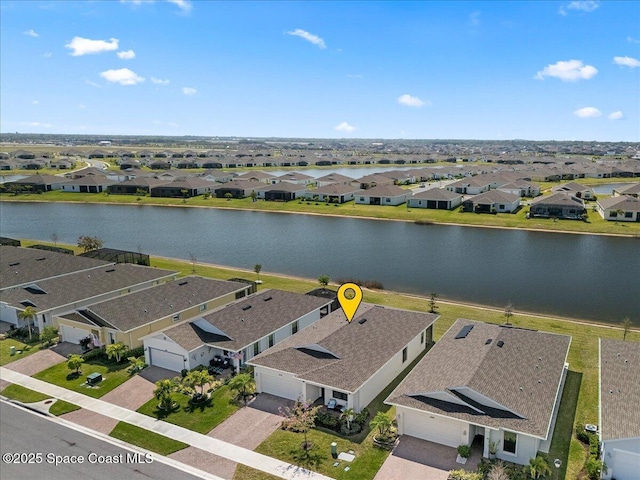 bird's eye view with a residential view and a water view