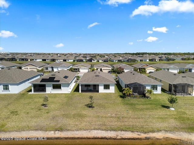 birds eye view of property with a residential view