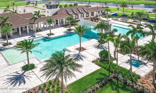 view of pool featuring a water view