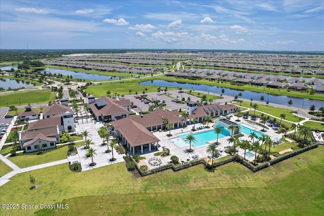 aerial view with a residential view and a water view