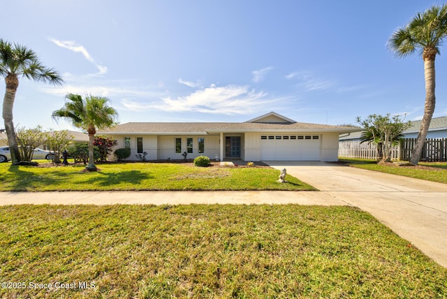 single story home featuring a front lawn, an attached garage, fence, and driveway