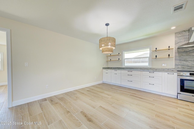 kitchen with visible vents, light wood-style flooring, electric range, white cabinets, and open shelves