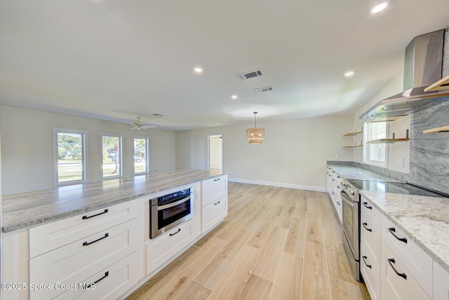 kitchen featuring white cabinetry, open shelves, visible vents, and stainless steel appliances