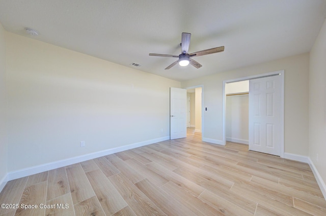 unfurnished bedroom featuring visible vents, baseboards, and light wood-style floors