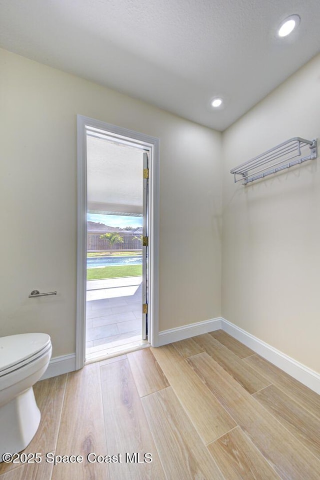 interior space with recessed lighting, baseboards, and light wood-style floors