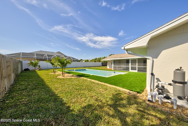 view of yard featuring a fenced in pool, a fenced backyard, and a sunroom