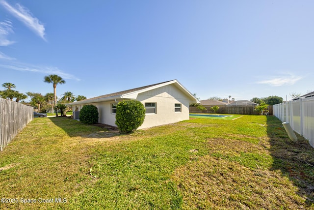 view of yard with a fenced in pool and a fenced backyard