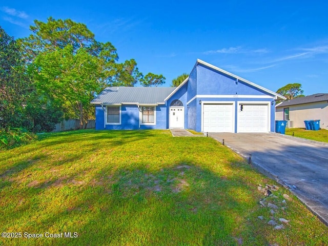 view of front facade featuring stucco siding, an attached garage, concrete driveway, and a front lawn