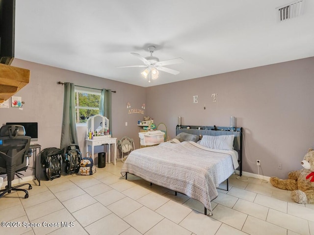 tiled bedroom featuring visible vents, baseboards, and a ceiling fan