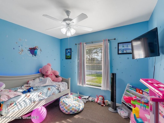 bedroom with baseboards and a ceiling fan