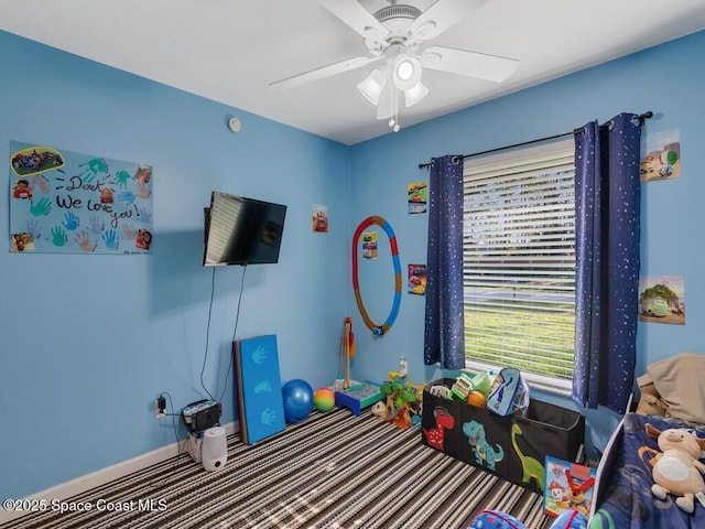 game room featuring baseboards and ceiling fan