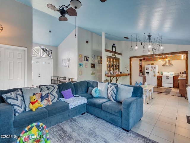 living room with vaulted ceiling, light tile patterned floors, and ceiling fan