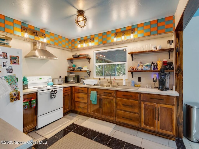 kitchen with a sink, open shelves, white appliances, wall chimney exhaust hood, and light countertops