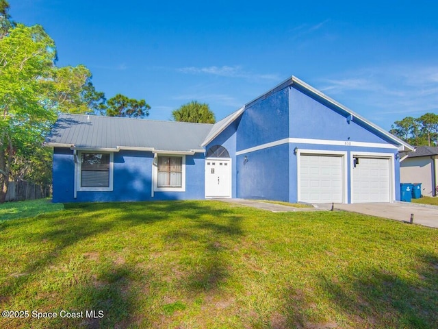 view of front facade featuring a garage, stucco siding, concrete driveway, and a front yard