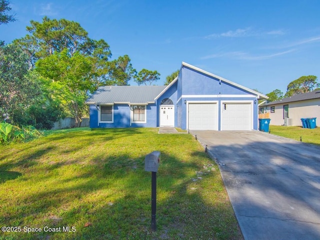 view of front facade featuring stucco siding, an attached garage, driveway, and a front lawn